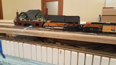 Model train set with detailed buildings and tracks.