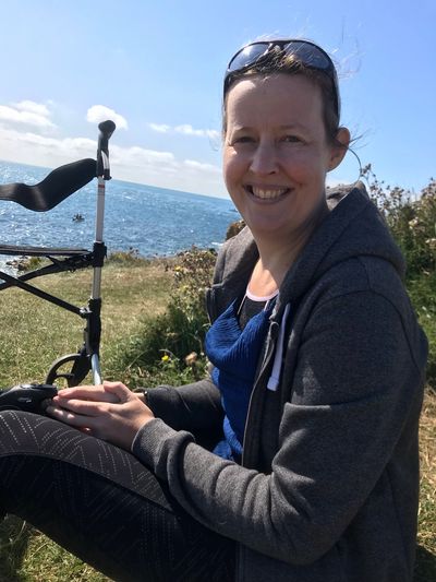 Charlie with zimmer frame near the sea