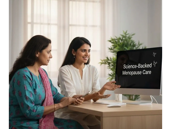 Two women discussing science-backed menopause care in a bright room.
