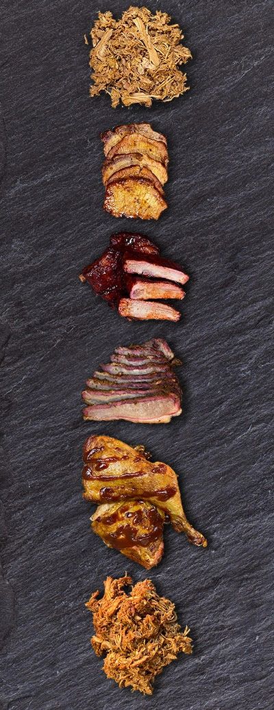Selection of meats on a plate. Chopped Pork BBQ, Sliced Pork, BBQ Ribs, Beef Brisket, Smoked Chicken