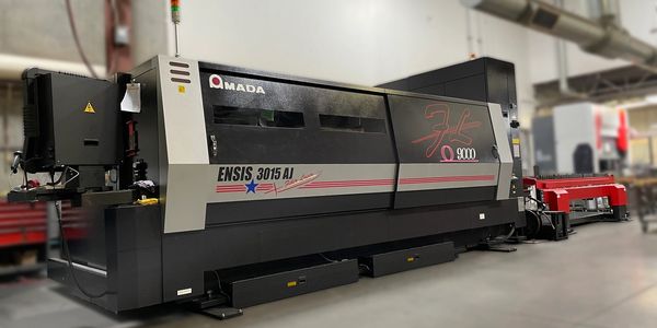 An Amada Laser cutting machine in a warehouse 
