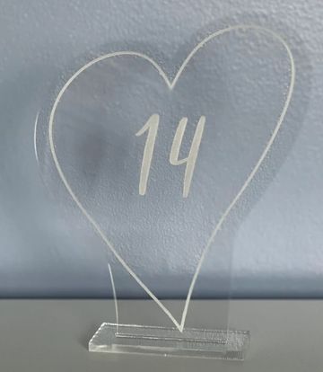 Transparent heart-shaped acrylic plaque with the number 14 inside.
