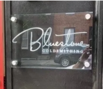 Rectangular glass sign with company logo etched on the back, smooth on the front