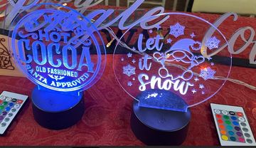 Six Inch Round LED illuminated sign with either "Hot Cocoa" or "Let It Show" design