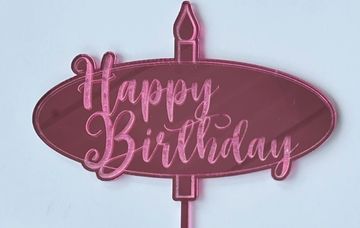 Pink "Happy Birthday" sign shaped like a candle.
