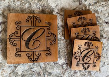 Double-layer 6" square trivet and set of four 4" square coasters, uniquely engraved with a monogram 