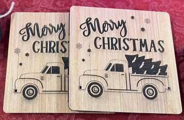 Wood square, double-layered trivet with a Christmas truck design that says "Merry Christmas"
