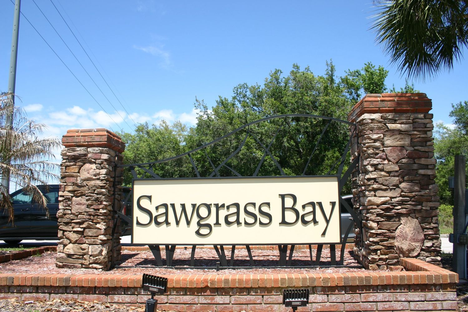 Entrance sign for Sawgrass Bay community.