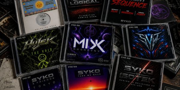 Collection of SYKO music CDs with colorful, futuristic designs.