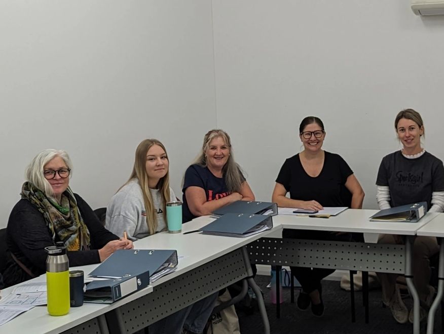 Group of students studying aged Care certificate three training. 