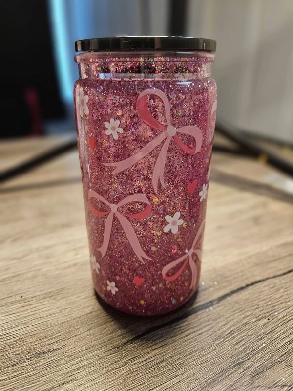 Pink bow snow globe cup with tons of pink glitter.