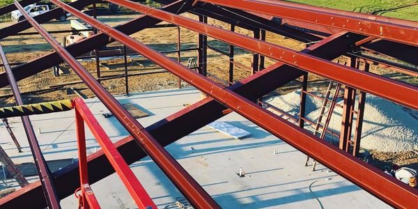 Steel beams forming a building's structural framework.