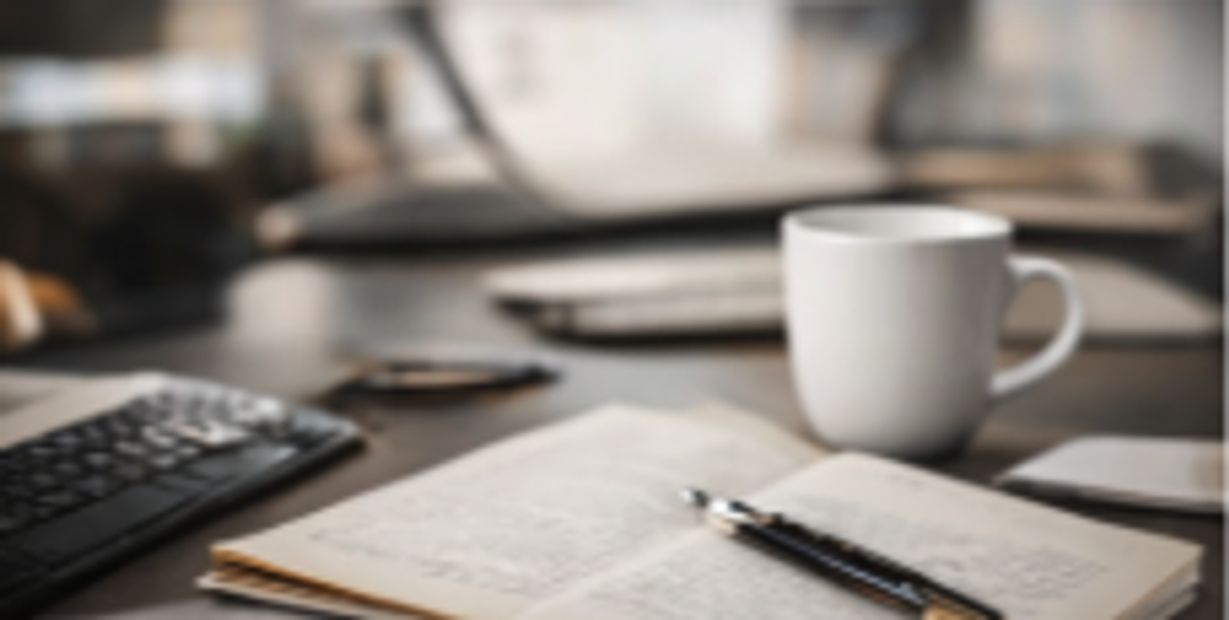 On the table open book with pain and cope with keyboard