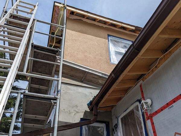 Scaffolding outside of a house for stucco work