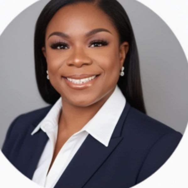 Professional woman in business attire smiling.