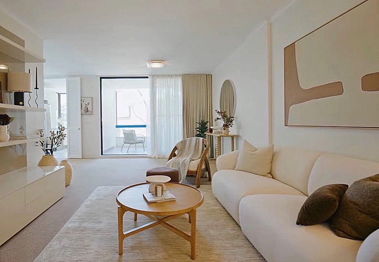 Bright modern living room with neutral tones and minimalist decor.