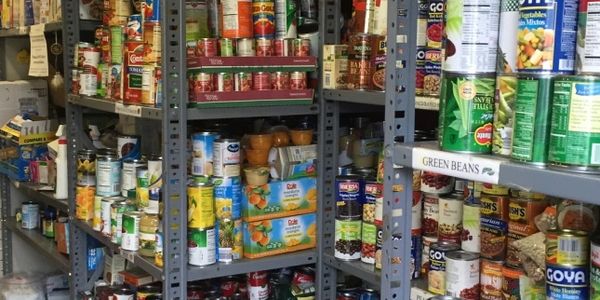 Cans of food on pantry shelves