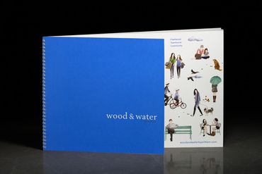 A blue spiral-bound book titled 'wood &amp; water' with a white illustrated cover.