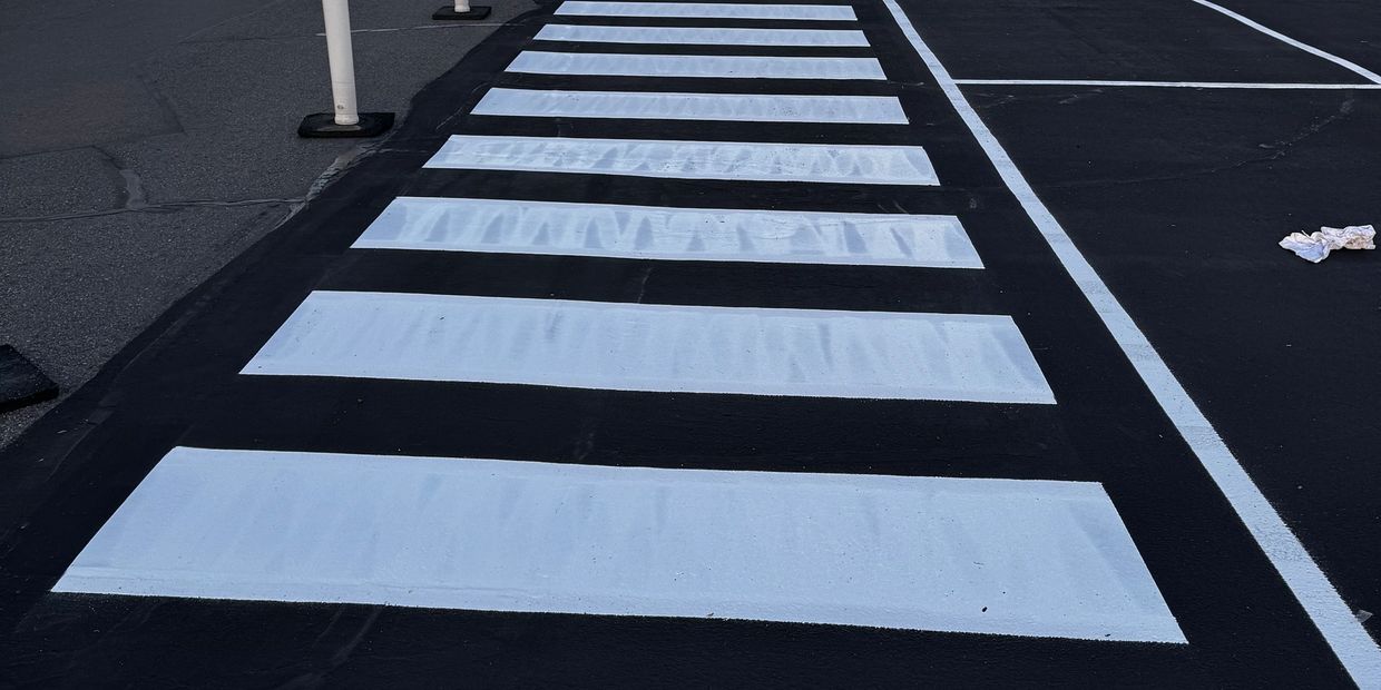Crisp, high-visibility ladder crosswalk striping for pedestrian safety and ADA compliance — Madsen Striping brings the same precision to properties across Idaho.