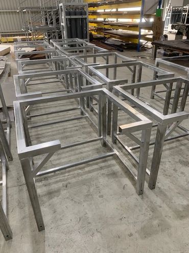Metal table frames in a workshop.