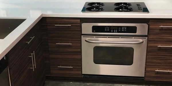 walnut brown cabinets white countertop