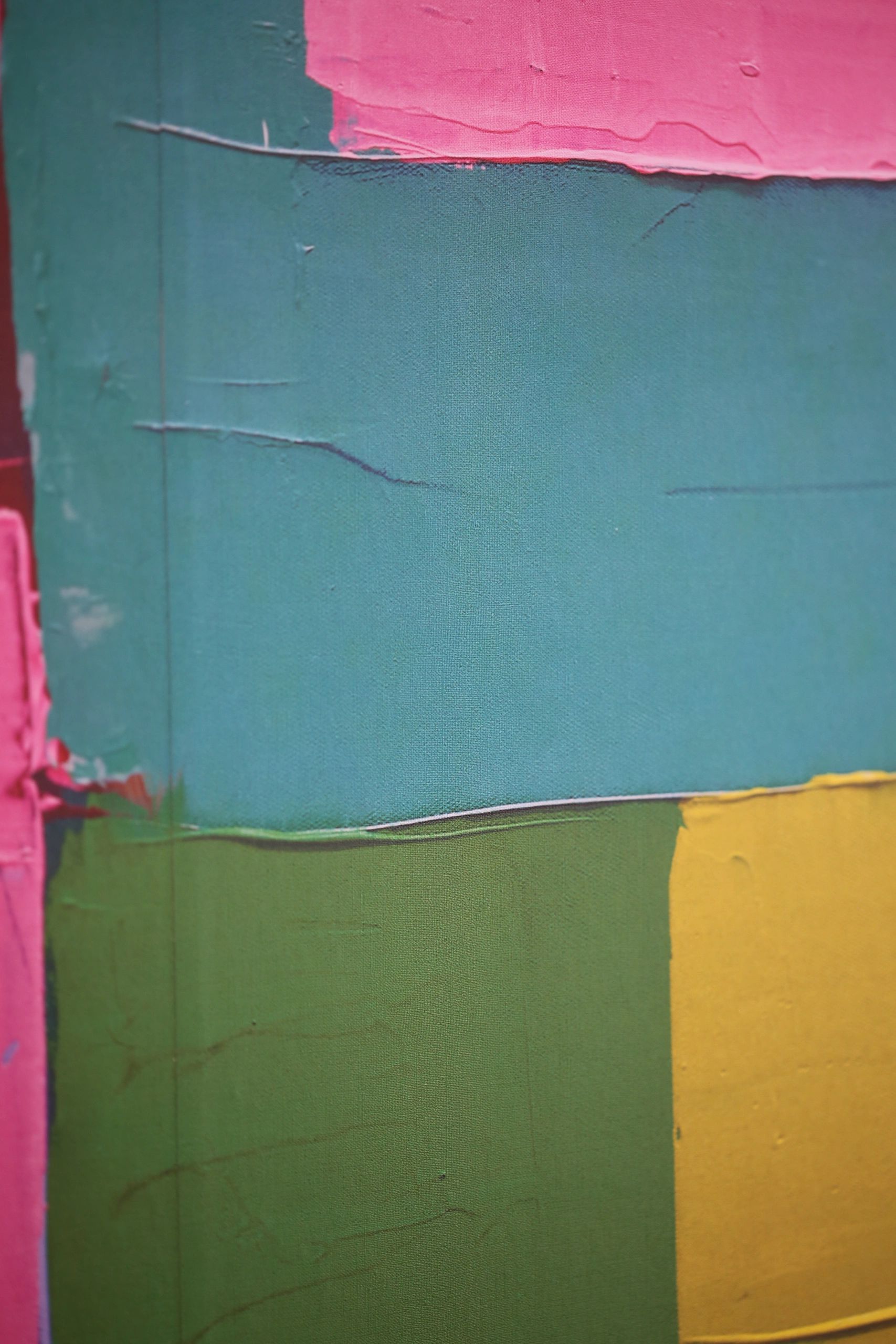 Abstract painting with teal, pink, green, and yellow blocks.