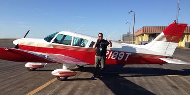 Casey Trammell in front of Cherokee N2189T, 2014 in Vernon, TX