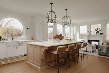 Modern kitchen with a large island and stylish lighting.