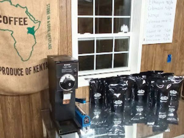 Table and coffee grinder available at the coffee shop for customer use.