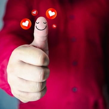 Thumbs up with smiley face and hearts.