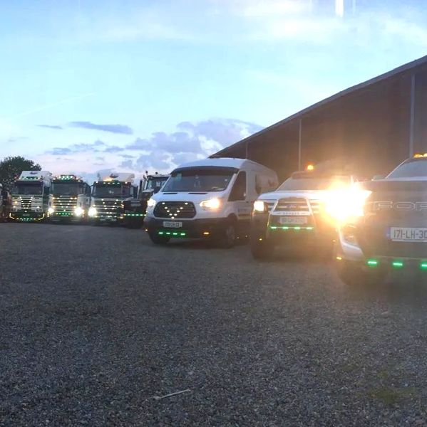 Fleet in yard. Collection of lorries and jeeps.