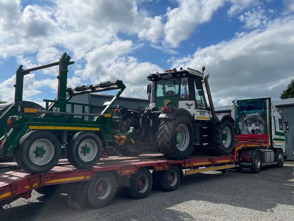 Scania lorry and low loader. JCB Fastrac and cable trailer loaded up.