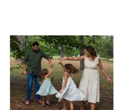 Austin family photographer capturing an outdoor family portrait session with parents, two daughters