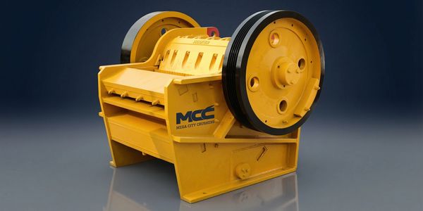Yellow industrial rock crusher machine with large wheels on a reflective surface.