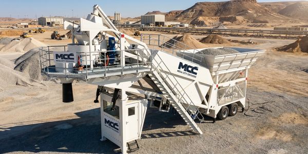 Mobile concrete batching plant in a desert construction site.