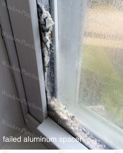 A failed aluminum spacing system between panes of glass.
