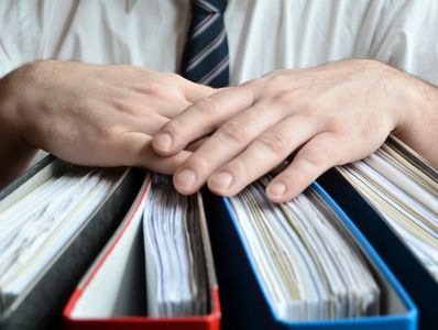 Investigator's hands on books and records of the organization.