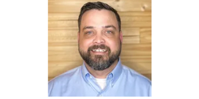 men in blue shirt smiling