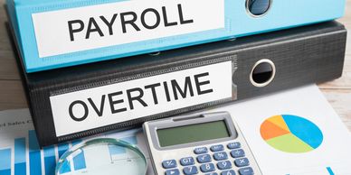 Payroll, Overtime. Binder data finance report business with graph analysis in office