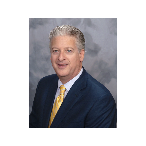 professional man in navy blue suit yellow tie