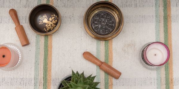 Mindfulness. Tibetan Sound bowls, two candles and a succulent plant. meditation classes