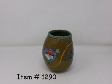 Small decorative vase with colorful designs on a plain background.