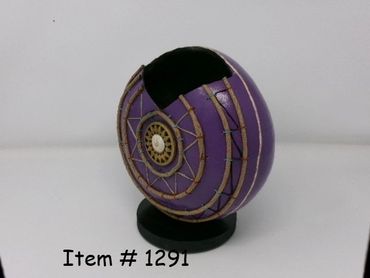 Purple spherical object with a mechanical design and a black top section.