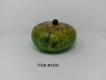 Decorative round box with hummingbird and floral design.