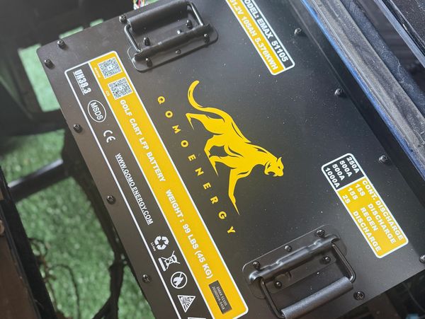 Qomo Energy golf cart LiFe battery with panther logo.