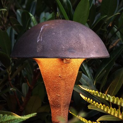 Cast Lighting Mushroom Pathlight in a bed of ferns.