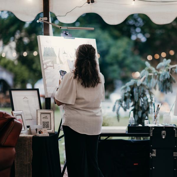 Artist Erin Leigh Boughamer of Event Painting by Erin painting a wedding live at Angel & Anchor Farm