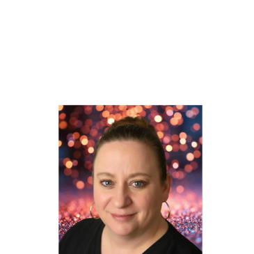 Portrait of a smiling woman with a festive bokeh background.