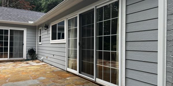 House Washing with large sliding glass doors and stone patio.

Exterior Cleaning