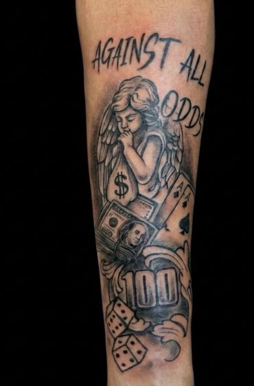 Tattoo with angel, money, cards, dice, and phrase "Against All Odds."